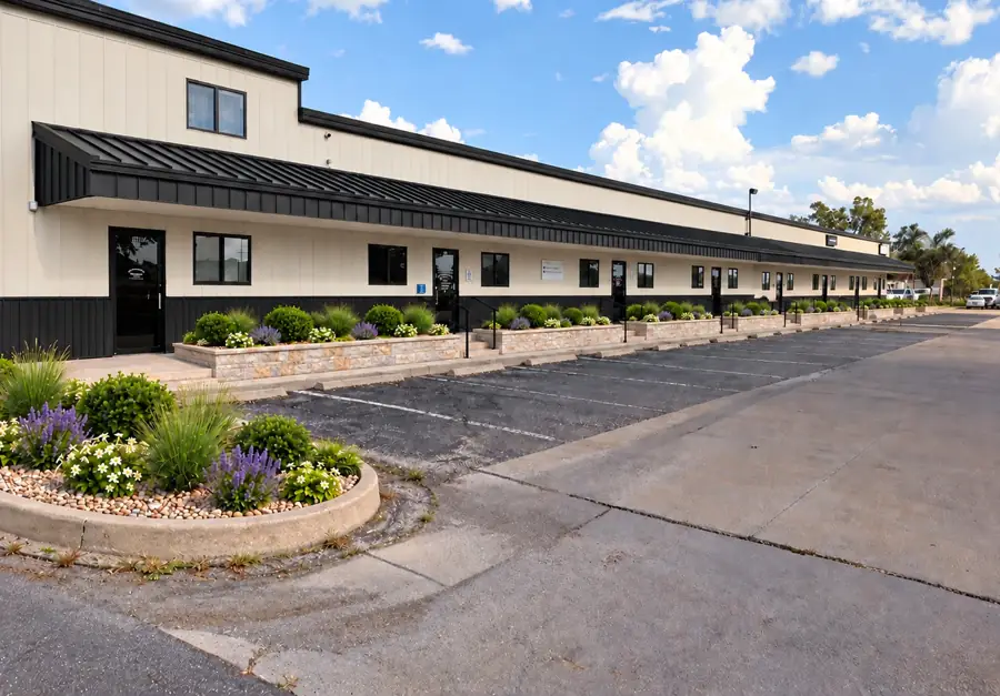 Rendering of the renovated building on Franklin Road: eight storefront entries A to H, the tall flex suite at the left end